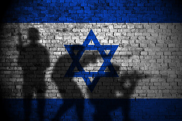 Israel flag on brick wall and soldiers shadow
