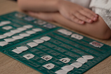 A map of letters, syllables and counting revealed to the child
