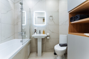 Every bathroom should have four essential items a handwashing sink for cleanliness, a toilet for sanitation, a relaxation bathtub for unwinding, and a mirror for grooming