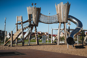 This playground is beautifully designed, showcasing a thrilling slide and an exhilarating rope...