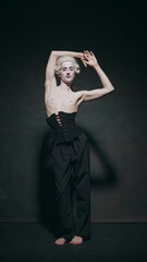 Young man, medieval character posing, exudes aura of aristocratic charm fused with modern...