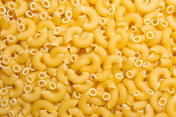 Uncooked Chifferi Rigati Pasta: A Culinary Canvas of Chifferi Rigati, Creating a Lively and Textured Background for Gourmet Cooking. Dry Pasta. Raw Macaroni - Top View, Flat Lay