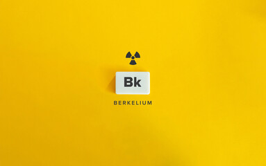 Berkelium (Bk) Banner image. Radioactive Chemical Element. Radioactivity Symbol and Text on Block Letter Tile on Yellow Background.