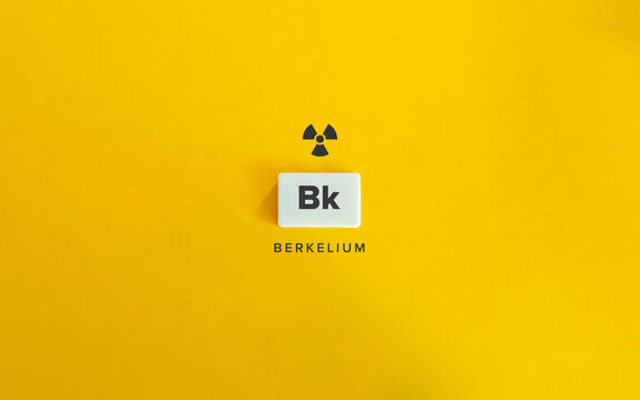 Berkelium (Bk) Banner image. Radioactive Chemical Element. Radioactivity Symbol and Text on Block Letter Tile on Yellow Background.