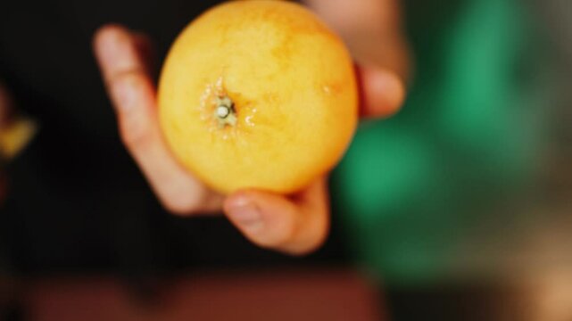 A confectioner grates citrus peels of lemon, lime, and orange. Production of citrus zest. Concept of confectionery products