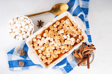Delicious autumn sweet potato or pumpkin casserole with toasted marshmallow topping. Thanksgiving,...