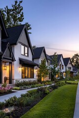Naklejka premium Lush lawns front newly built homes with unique designs on a suburban street.