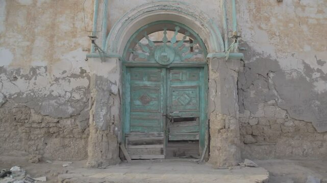 Sudan, Port Sudan, Suakin, huge green door of a ruined ottoman coral buildings
