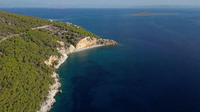 Slow motion drone flight over beautiful Mediterranean island with deep blue ocean