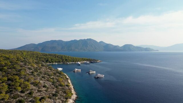 Stunning scenery on Greek island with parked yachts, drone shot