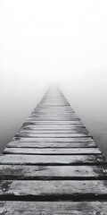 Obraz premium Wooden pier stretches into the fog above calm water evoking solitude and serenity in a minimalist setting