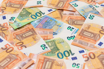 Different Euro Banknotes Money Background. Euro Money Currency. Colored Paper Money. A Lot of Fifty Euro Bills. Business, Finances, Cash and Money Saving Concept