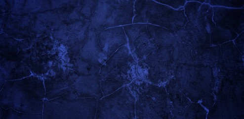 long background of cracked wall blue color. blue wall texture background marked by long exposure to the elements outdoors and painting peeling off.