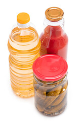 Food Reserves: Canned Food, Sunflower Oil and Tomato Juice - Isolated on White Background. Emergency Food Storage in Case of Crisis. Strategic Food Supplies - Isolation