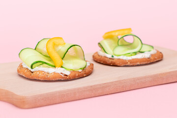 Crispy Cracker Sandwich with Fresh Cucumber, Yellow Paprika and Cottage Cheese on Cutting Board. Easy Breakfast. Quick and Healthy Sandwiches. Crispbread with Tasty Filling. Healthy Dietary Snack