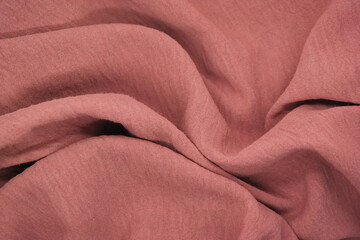 Abstract texture a wrinkled peach blanket