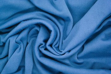 Abstract texture a wrinkled soft blue blanket