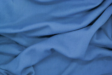 Abstract texture a wrinkled soft blue blanket