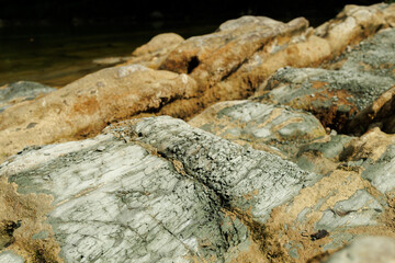 stones on the river and mountains in the forest close-up. Beautiful natural background.