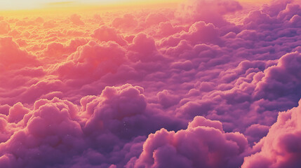 Fluffy clouds illuminated in warm pink and orange hues during a stunning sunset.