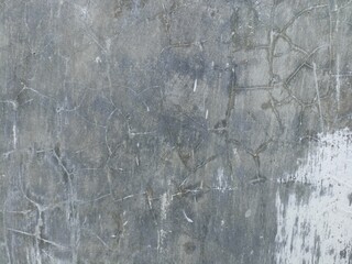Cracked and Weathered Concrete Wall Texture. Cracked, weathered concrete wall with subtle grunge pattern, perfect for industrial and vintage designs