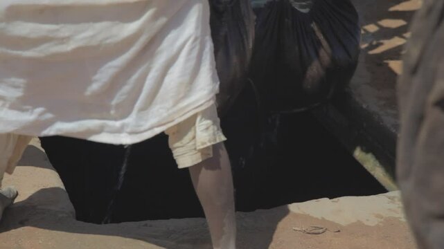 Sudan, Nubia, Naga, people taking water from a well in the desert