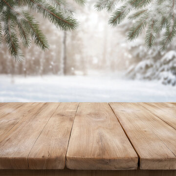 beautiful wooden table with fir branches on a winter background