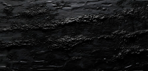 Obraz premium A textured black surface with subtle variations, suggesting depth and movement. Black and white background images -