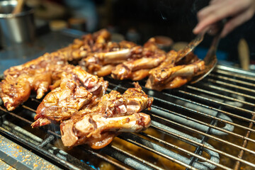 Sizzling Grilled Meat Dish Captured in Action at a Backyard Barbecue