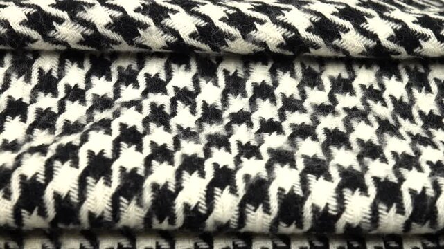 Folded black and white tweed fabric houndstooth classic pattern 
