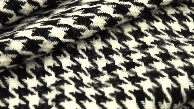 Folded black and white tweed fabric houndstooth classic pattern 