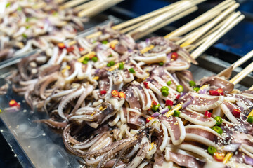 Delicious Grilled Squid Skewers Ready for a Flavorful Feast