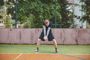 Obraz premium Volleyball player performing a digging on a hard court, focusing intently on the ball during an intense game. The action showcases skill, concentration, and athleticism