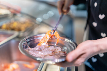 Fresh Seafood Preparation: Delicate Handling of Shrimp in a Culinary Setting