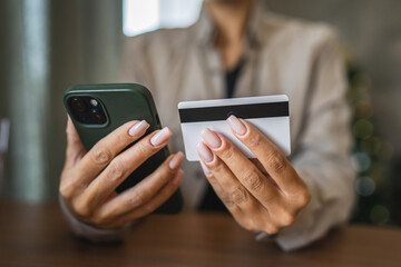 Adult woman use smart phone for online shopping transaction safely