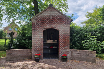 Roman catholic field chapel with small statue of 
Virgin Maria with infant Jezus