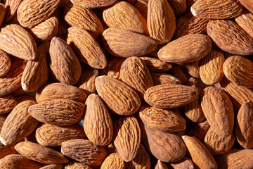 Scattered Almonds. Background from Almond Nuts. Natural High-Calorie Snacks
