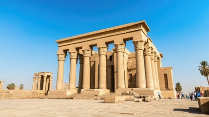 Fototapeta premium A famous historical landmark, such as an ancient castle or temple, standing proudly against a clear blue sky, with visitors exploring its rich history and architecture.