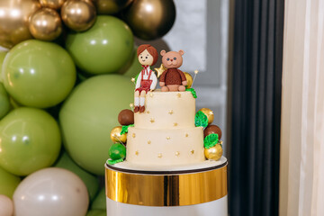 Luxury photo area with inflatable balloons in the reaturant for the firs year of child. One year party. Photozone of gold and blue balloons. Decor for children`s party