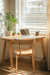 light wood table with simple design is paired with comfortable chair, creating cozy workspace. scene is enhanced by potted plants and natural light streaming through window, evoking serene