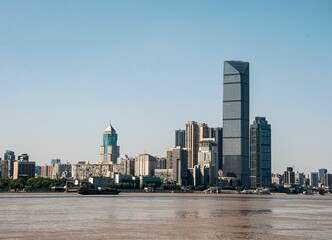 Naklejka premium Modern skyscrapes along the Yangtze River in Wuhan, China