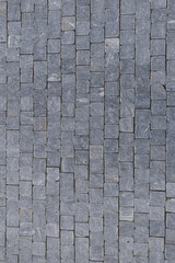 Granite cobblestone pavement forming a geometric pattern, a common sight in Prague