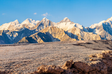 Gravel road square and snow mountain nature landscape at sunset. car background.