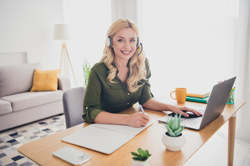 Photo of cheerful positive lady recruiter dressed shirt earphones communicating device hot line...