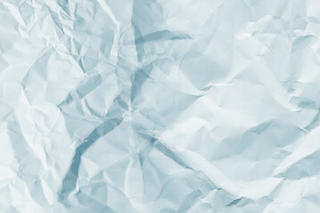 Crumpled white paper background.