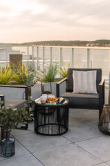 Residential building with roof terrace and waterfront view