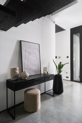 Modern minimalist hallway with sleek console table and artistic decor in contemporary home