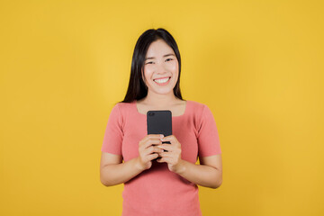 Portrait of smiling Asian woman using a smartphone