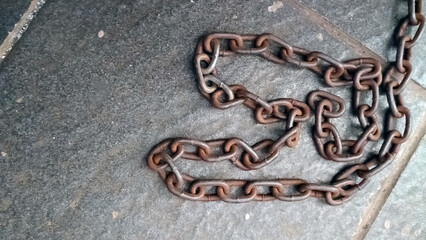 Close up of old rusty iron chain