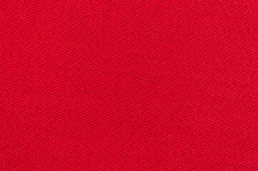 Fototapeta premium Macro image of red soft fabric. Red textured background image.